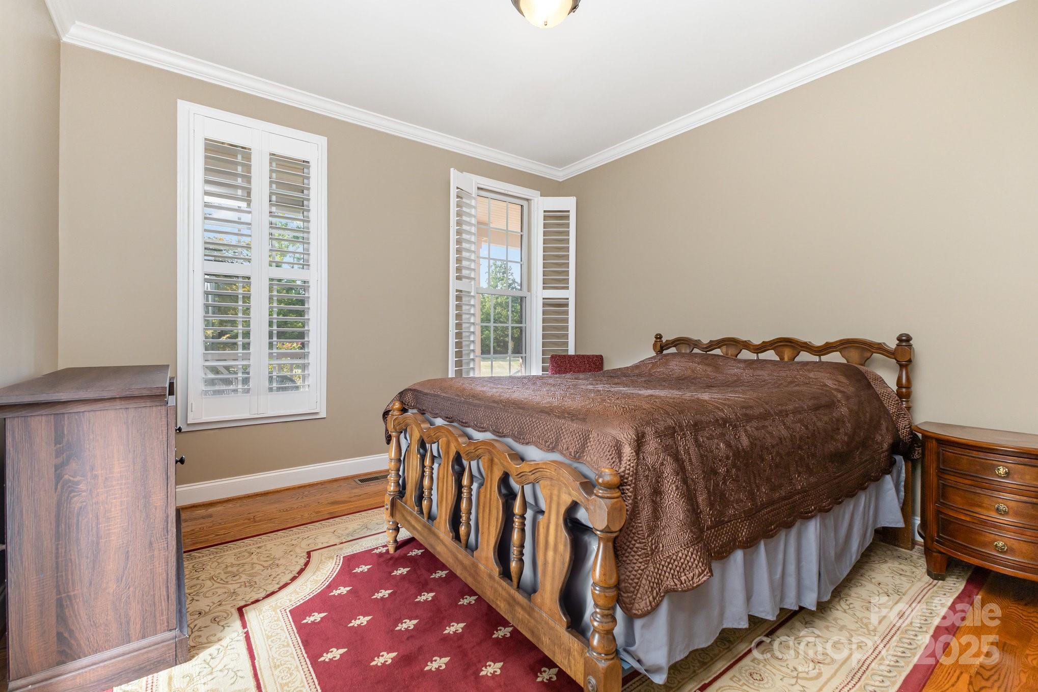 2227 Nash Road Wingate, NC 28174 - Photo 24 of 40 a spacious bedroom with a bed and a window