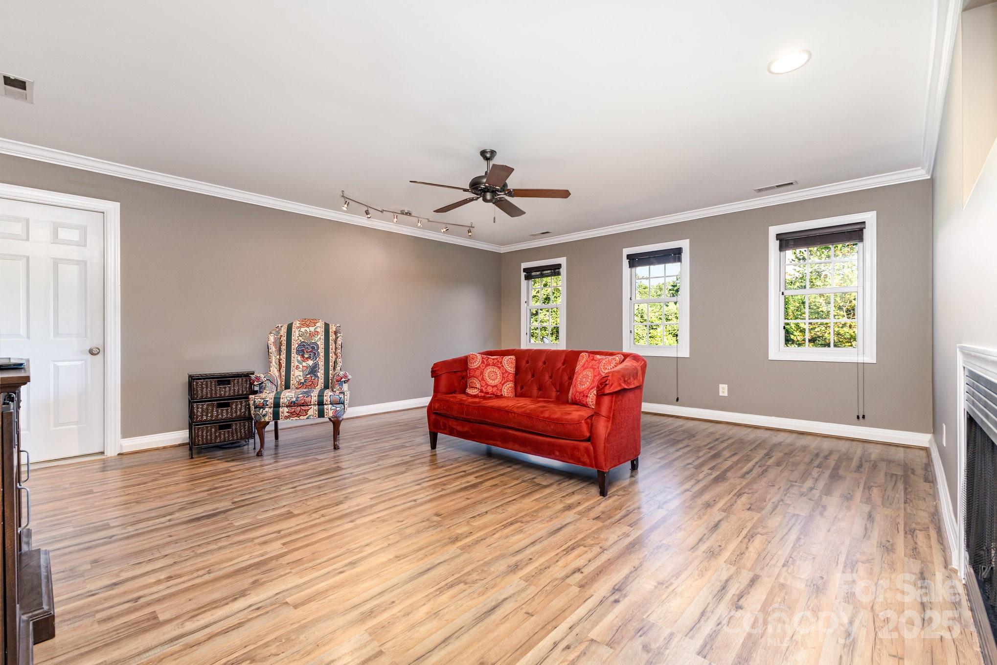 2227 Nash Road Wingate, NC 28174 - Photo 28 of 40 a living room with furniture and a wooden floor