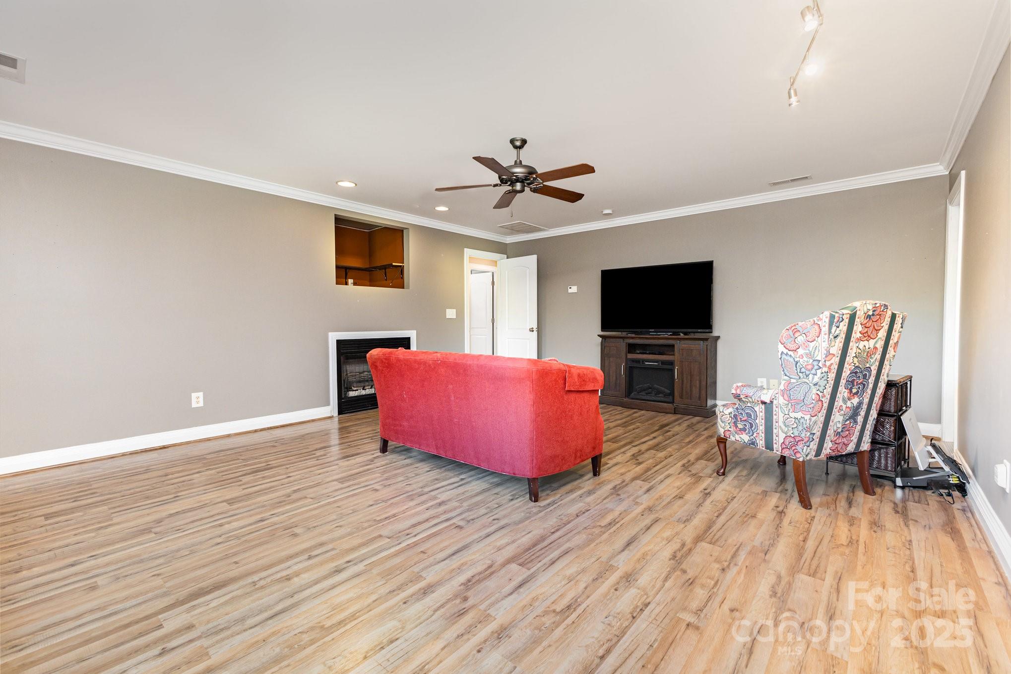 2227 Nash Road Wingate, NC 28174 - Photo 29 of 40 a living room with furniture and a flat screen tv