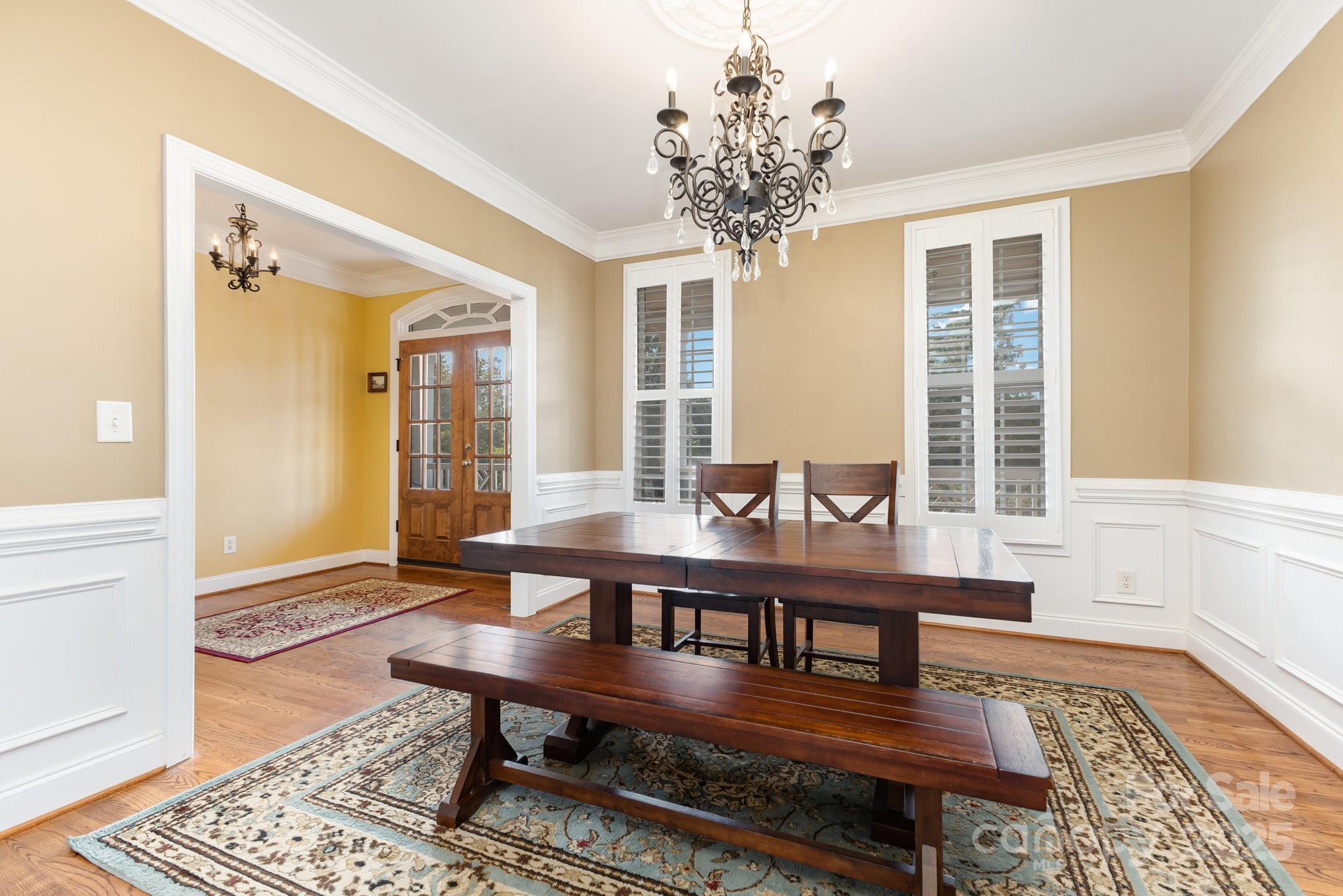 2227 Nash Road Wingate, NC 28174 - Photo 7 of 40 a view of a dining room with furniture window and wooden floor