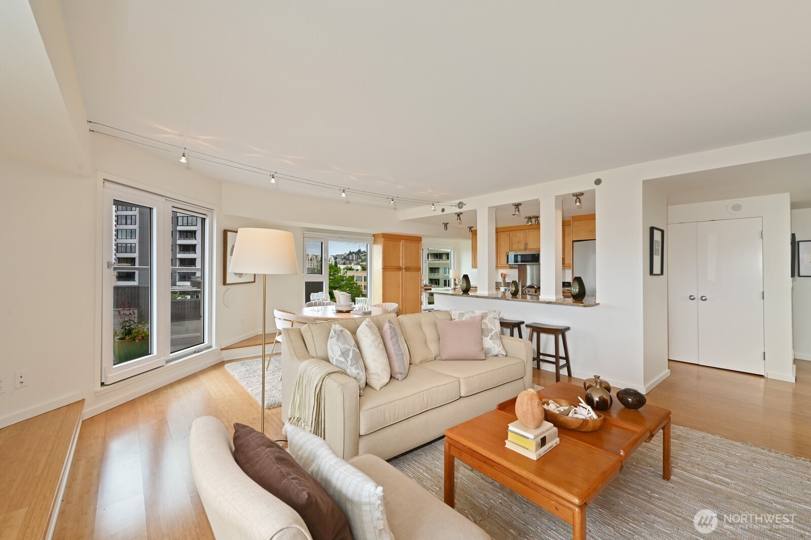 121 Vine Street, Unit 703 Seattle, WA 98121 - Photo 13 of 37 a living room with furniture and a wooden floor
