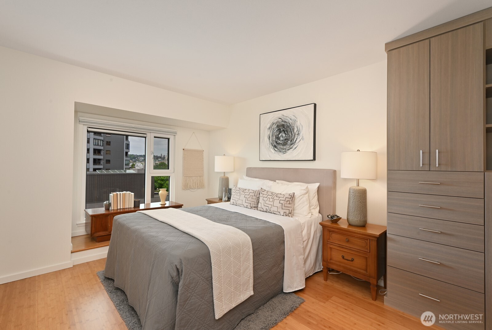 121 Vine Street, Unit 703 Seattle, WA 98121 - Photo 14 of 37 a bedroom with a bed and a large window