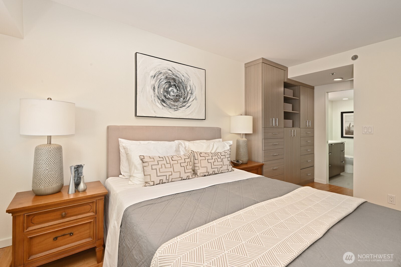 121 Vine Street, Unit 703 Seattle, WA 98121 - Photo 15 of 37 a bedroom with a bed and a lamp on table