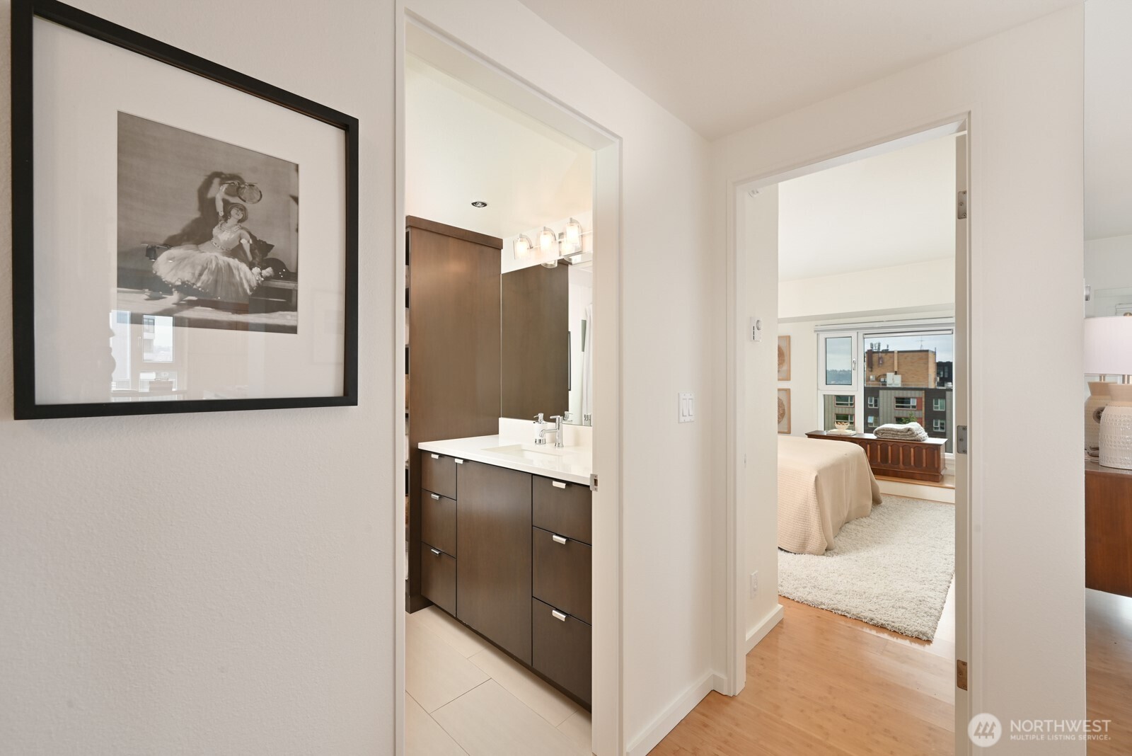 121 Vine Street, Unit 703 Seattle, WA 98121 - Photo 18 of 37 a en suite bathroom with a shower and mirror