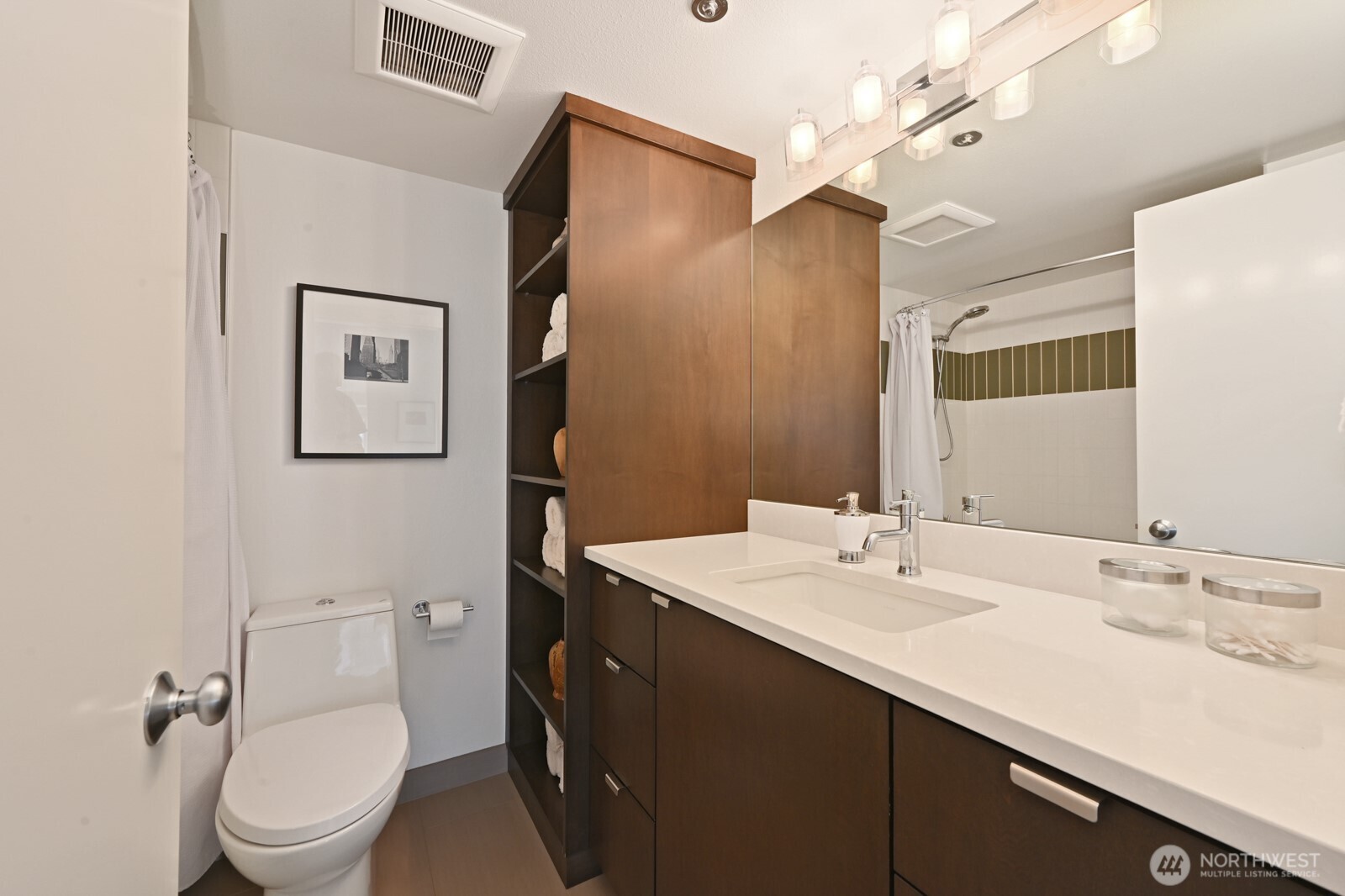 121 Vine Street, Unit 703 Seattle, WA 98121 - Photo 19 of 37 a bathroom with a sink a toilet and shower