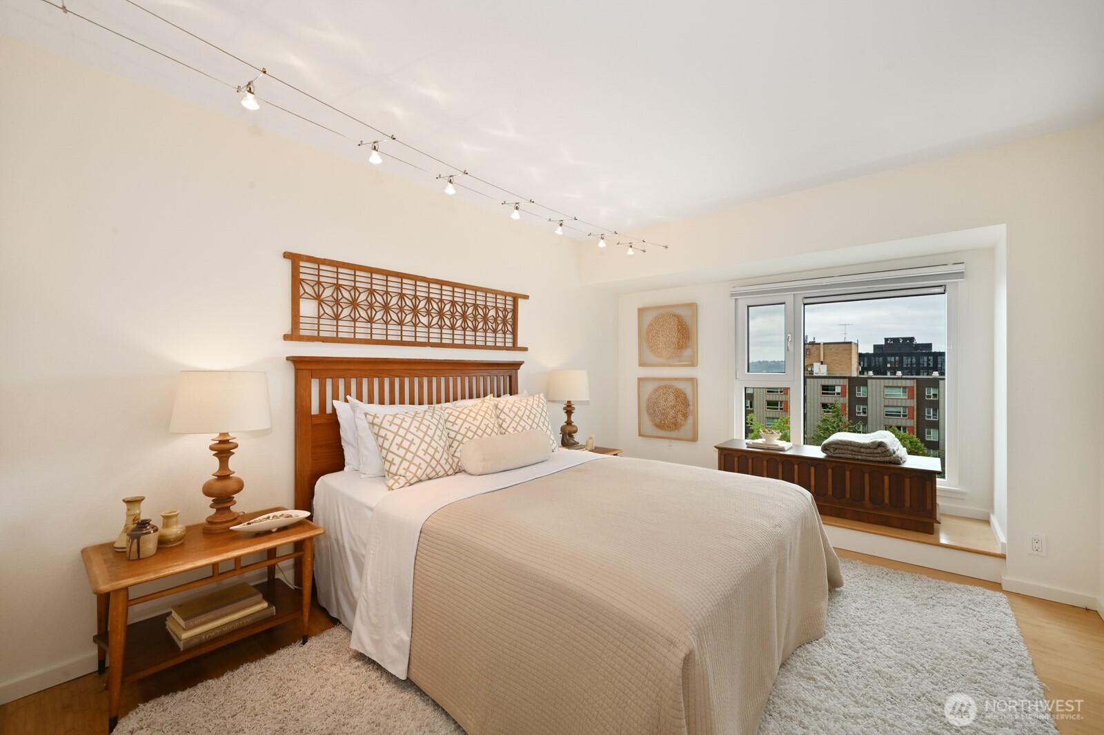 121 Vine Street, Unit 703 Seattle, WA 98121 - Photo 20 of 37 a bedroom with a bed and glass window