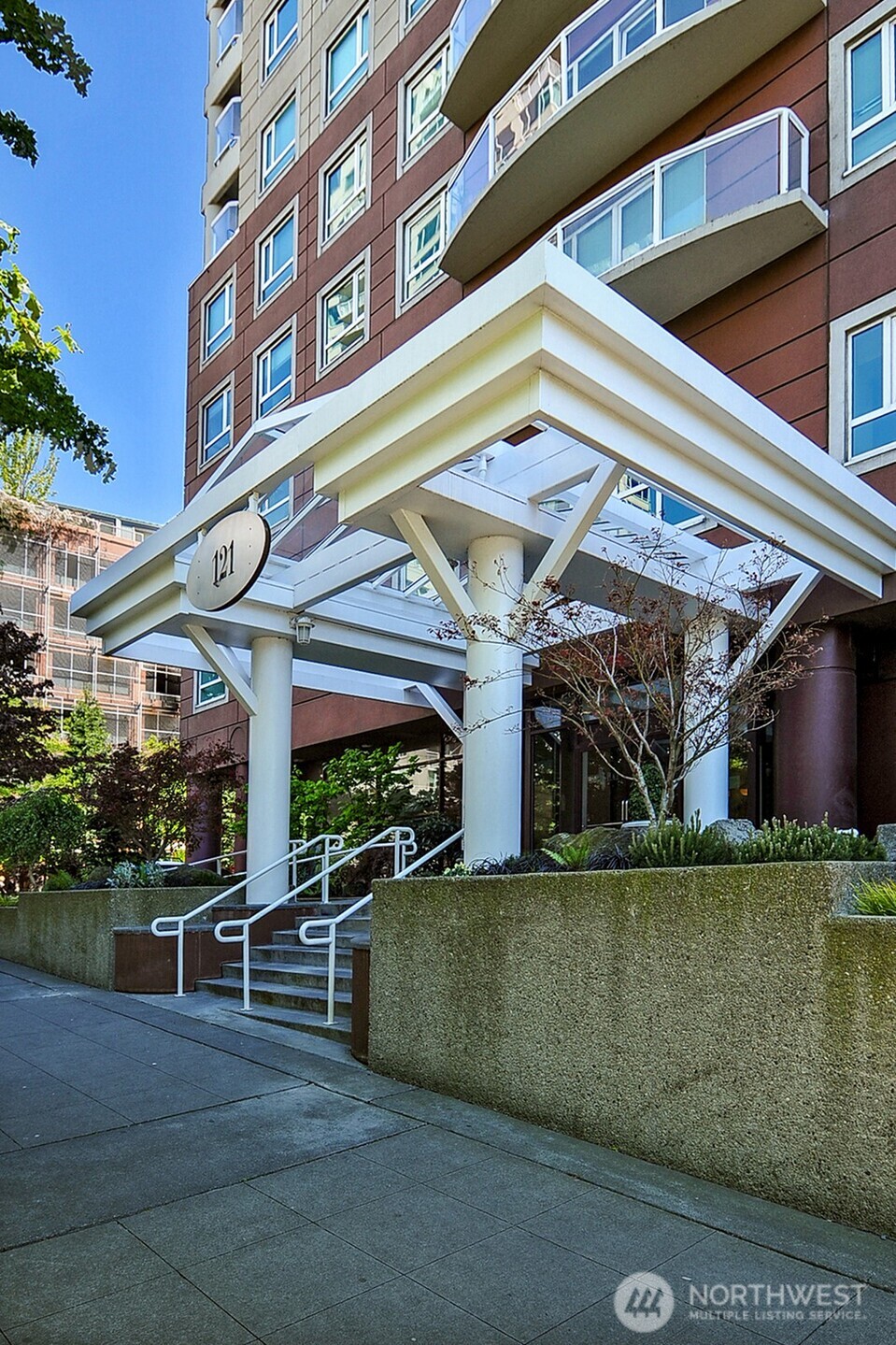 121 Vine Street, Unit 703 Seattle, WA 98121 - Photo 2 of 37 a view of a building with sitting area