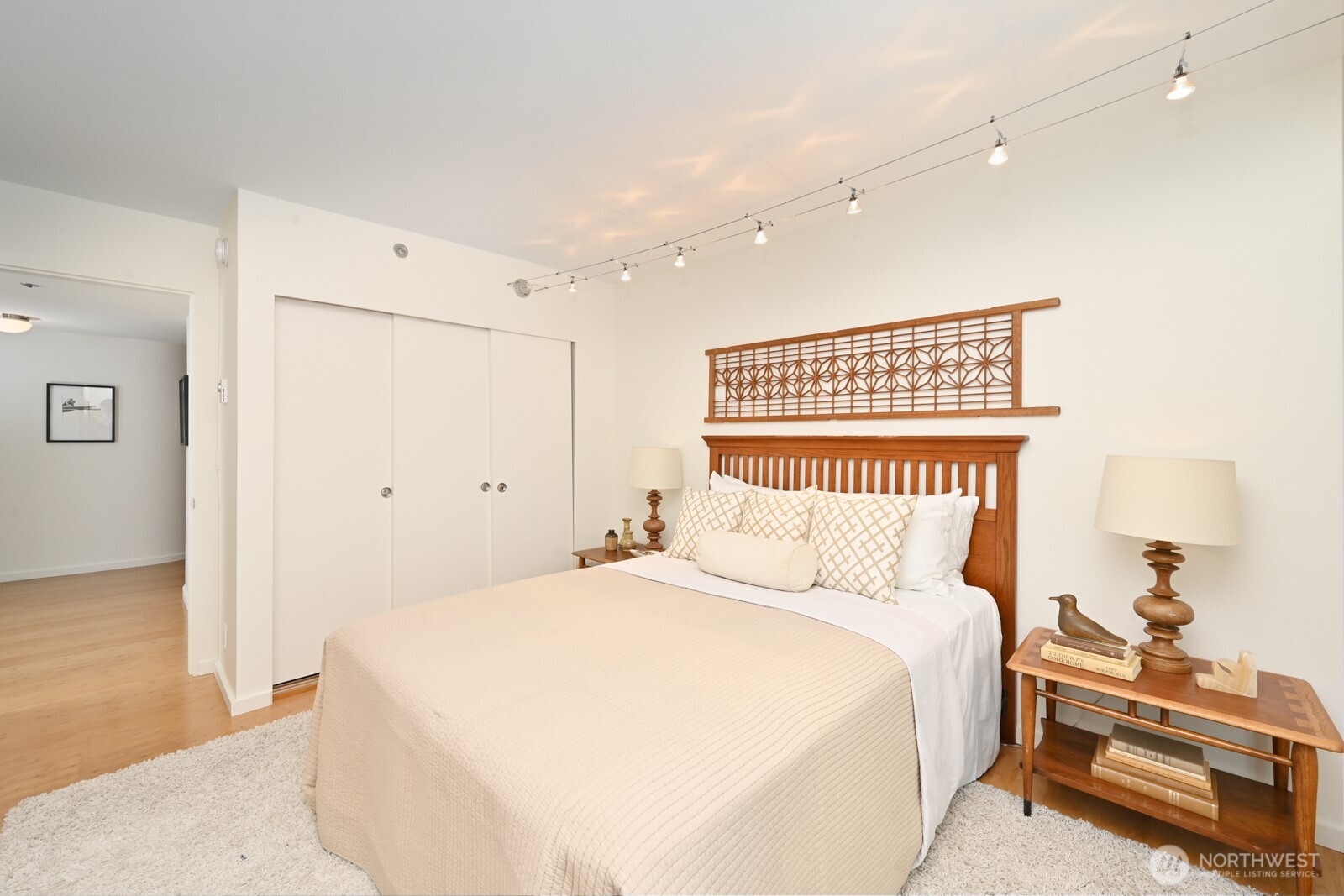 121 Vine Street, Unit 703 Seattle, WA 98121 - Photo 23 of 37 a bedroom with a bed and a lamp