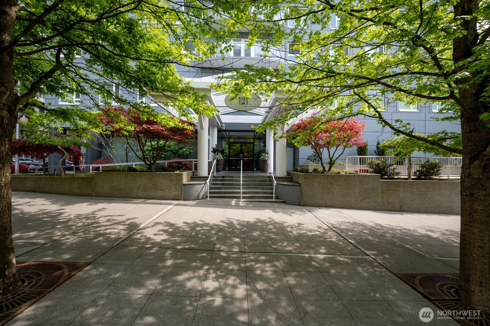 121 Vine Street, Unit 703 Seattle, WA 98121 - Photo 26 of 37 a view of a house with a tree in front of it