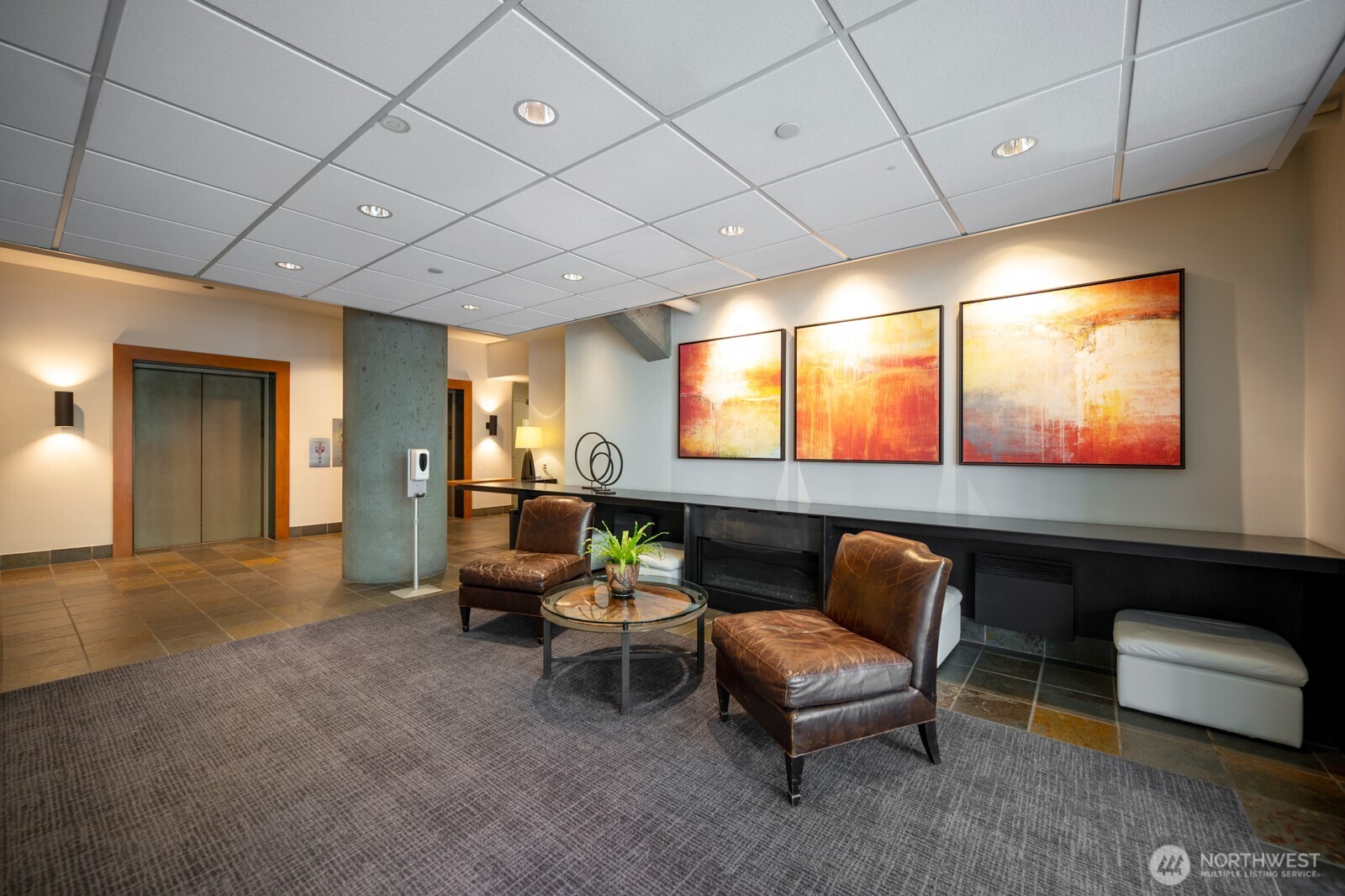 121 Vine Street, Unit 703 Seattle, WA 98121 - Photo 27 of 37 a outdoor living space with furniture and a projector screen