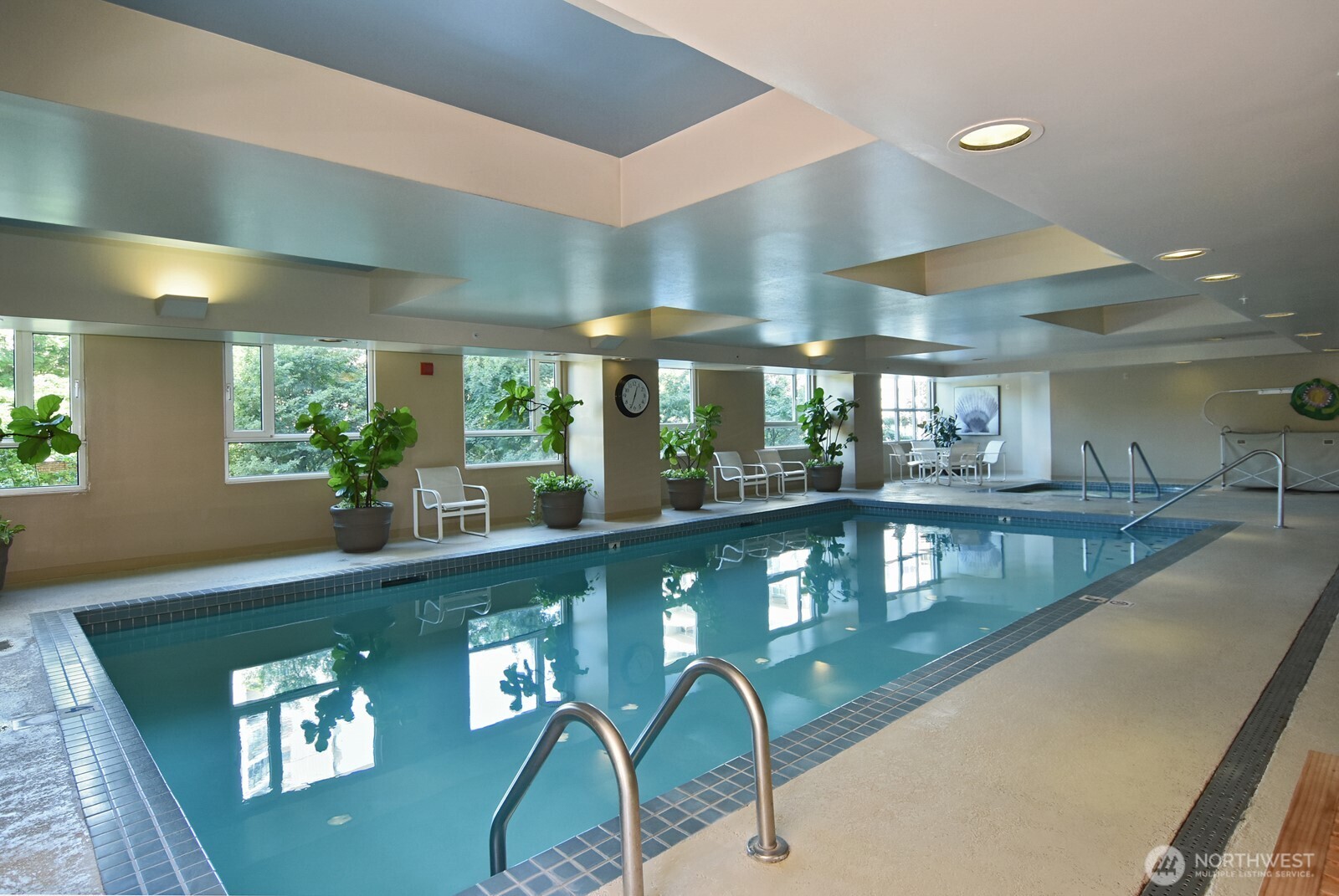 121 Vine Street, Unit 703 Seattle, WA 98121 - Photo 31 of 37 a view of a swimming pool and dining room