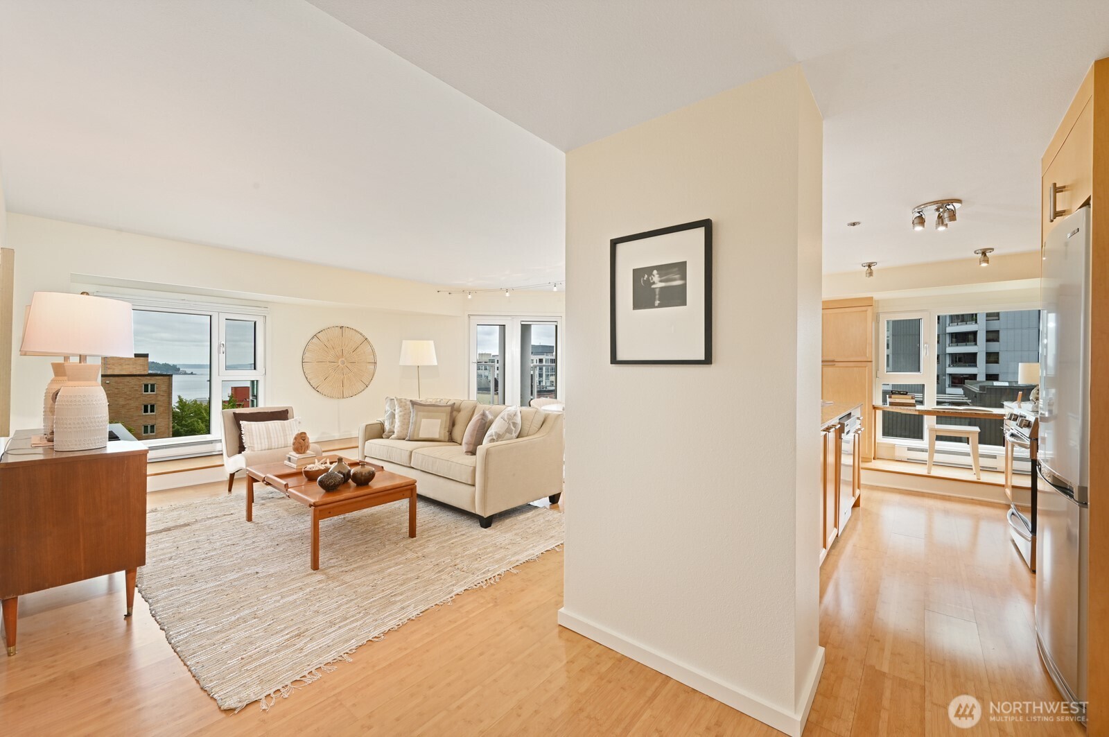 121 Vine Street, Unit 703 Seattle, WA 98121 - Photo 4 of 37 a living room with furniture and a table