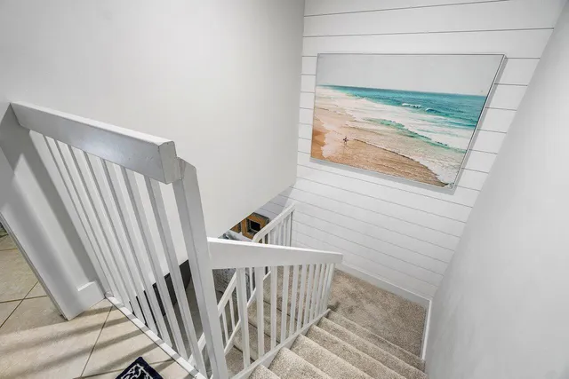 a view of a room with wooden floor and a window