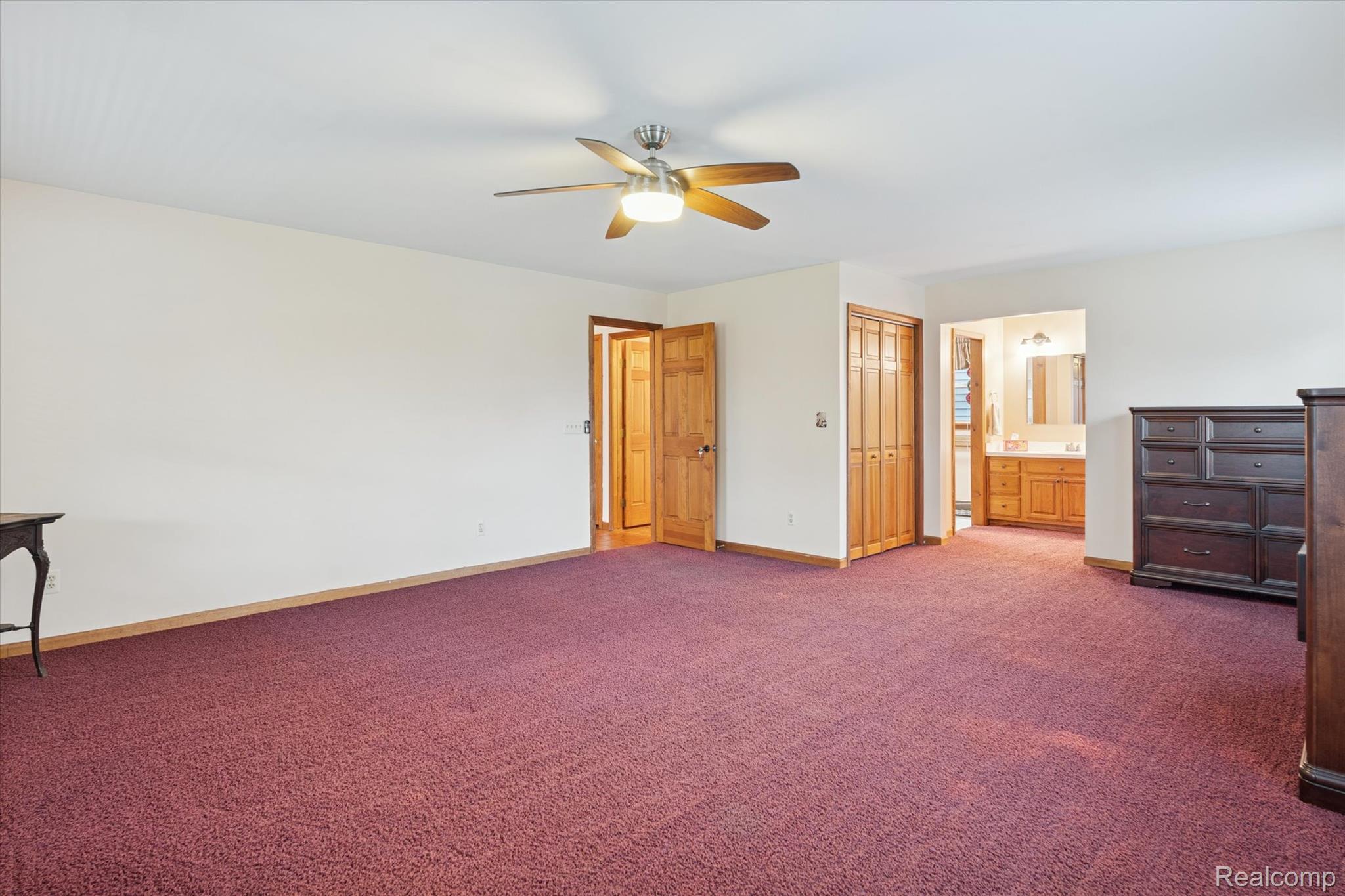 3031 Cedar Point Howell, MI 48843 - Photo 8 of 51 Unfurnished bedroom with carpet, a closet, ceiling fan, and ensuite bathroom