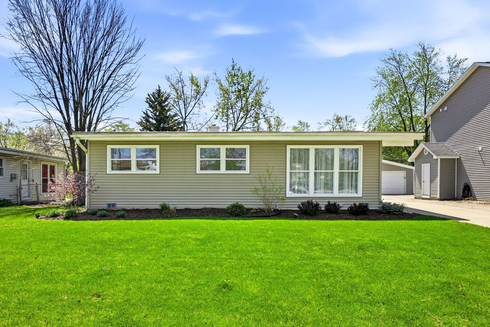 2117 Grouse Lane Rolling Meadows, IL 60008 - Photo 2 of 25 a front view of a house with a garden and yard