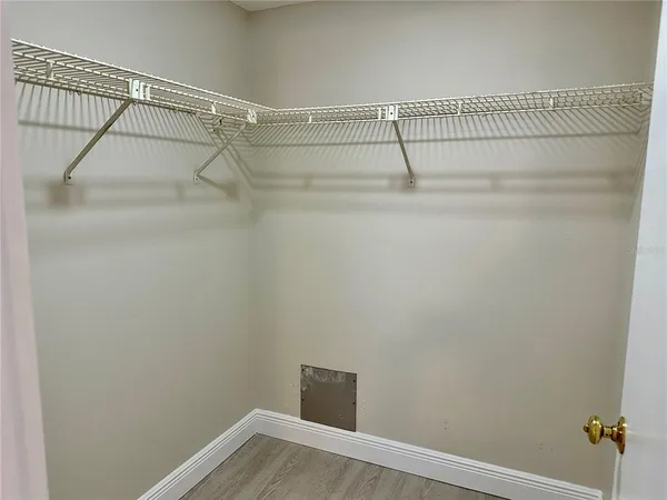 a view of a room with racks on the wall