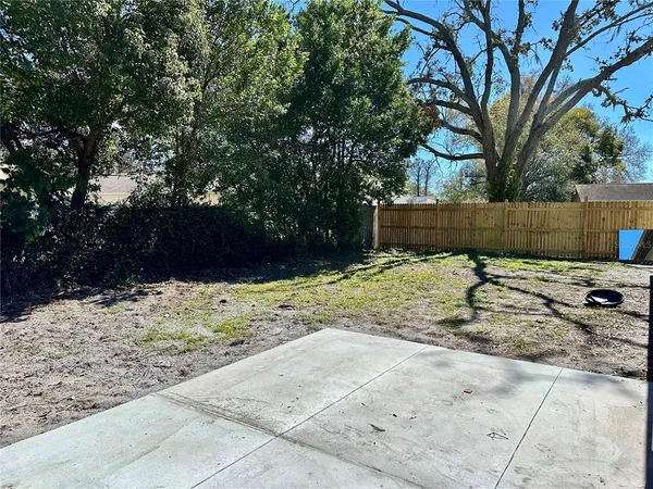 a view of a backyard of the house