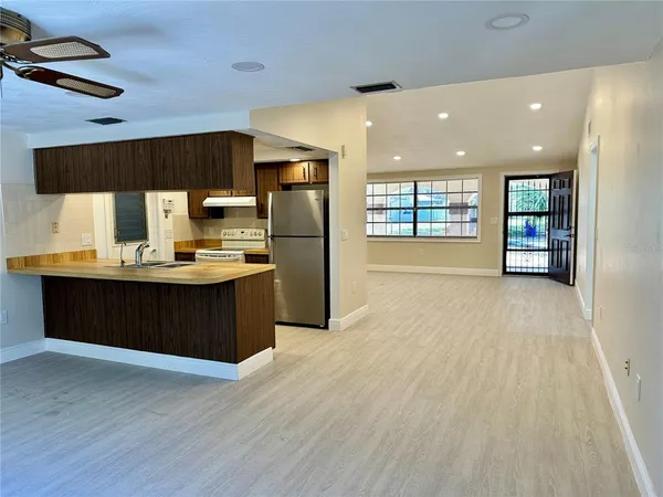 a kitchen with a sink and a refrigerator