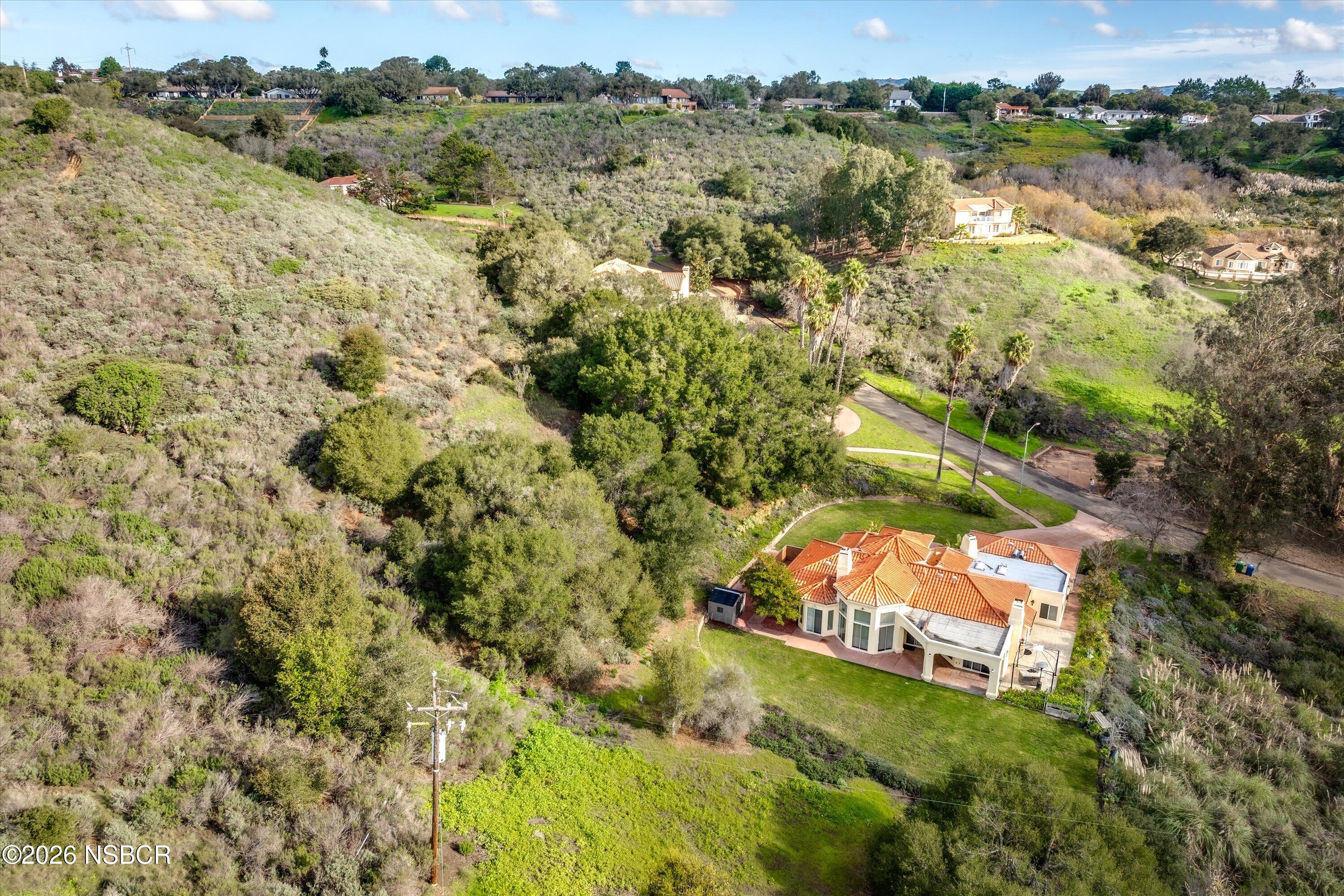 2655 Adobe Falls Road Lompoc, CA 93436 - Photo 48 of 51 a view of a lake with a house in the background
