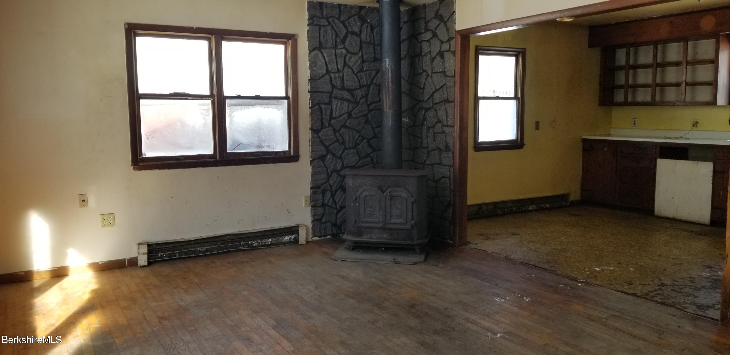 236 Sandisfield Road Sandisfield, MA 01255 - Photo 2 of 8 an empty room with windows