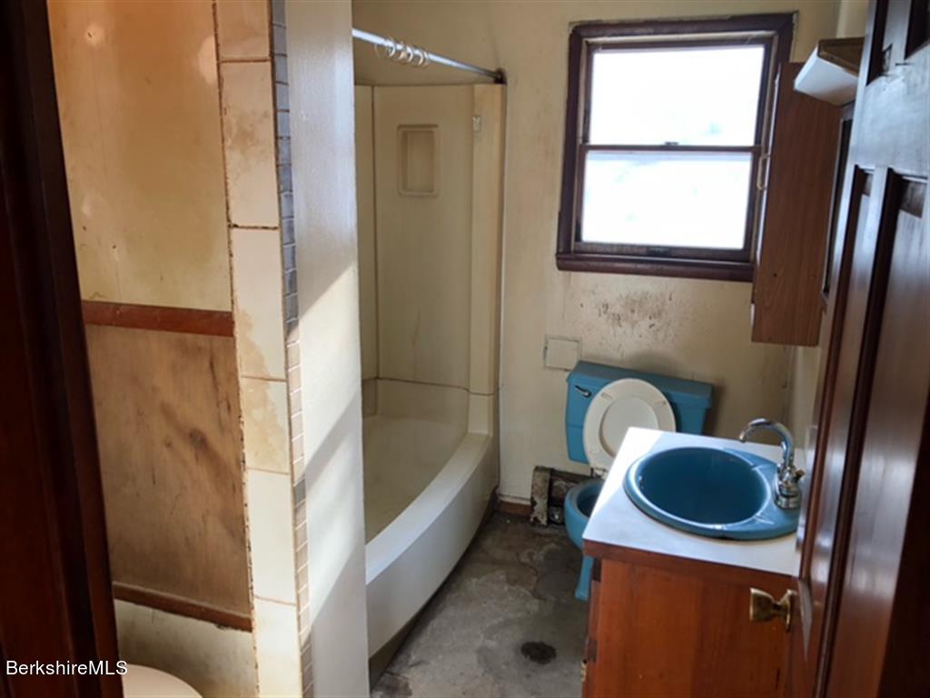 236 Sandisfield Road Sandisfield, MA 01255 - Photo 7 of 8 a bathroom with a sink a toilet and tub