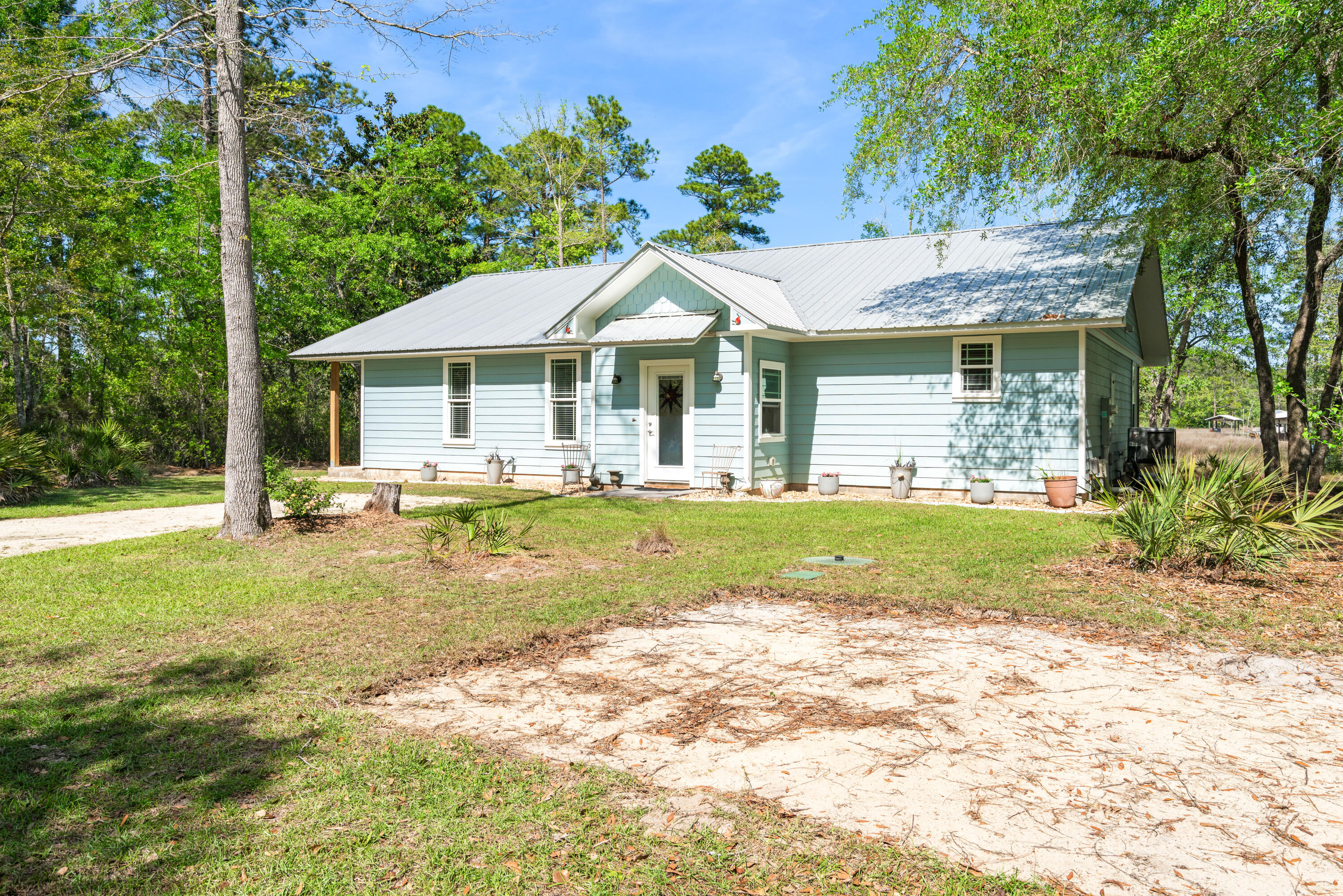 528 Bay Grove Road Freeport, FL 32439 - Photo 2 of 68 a view of a house with swimming pool and a yard