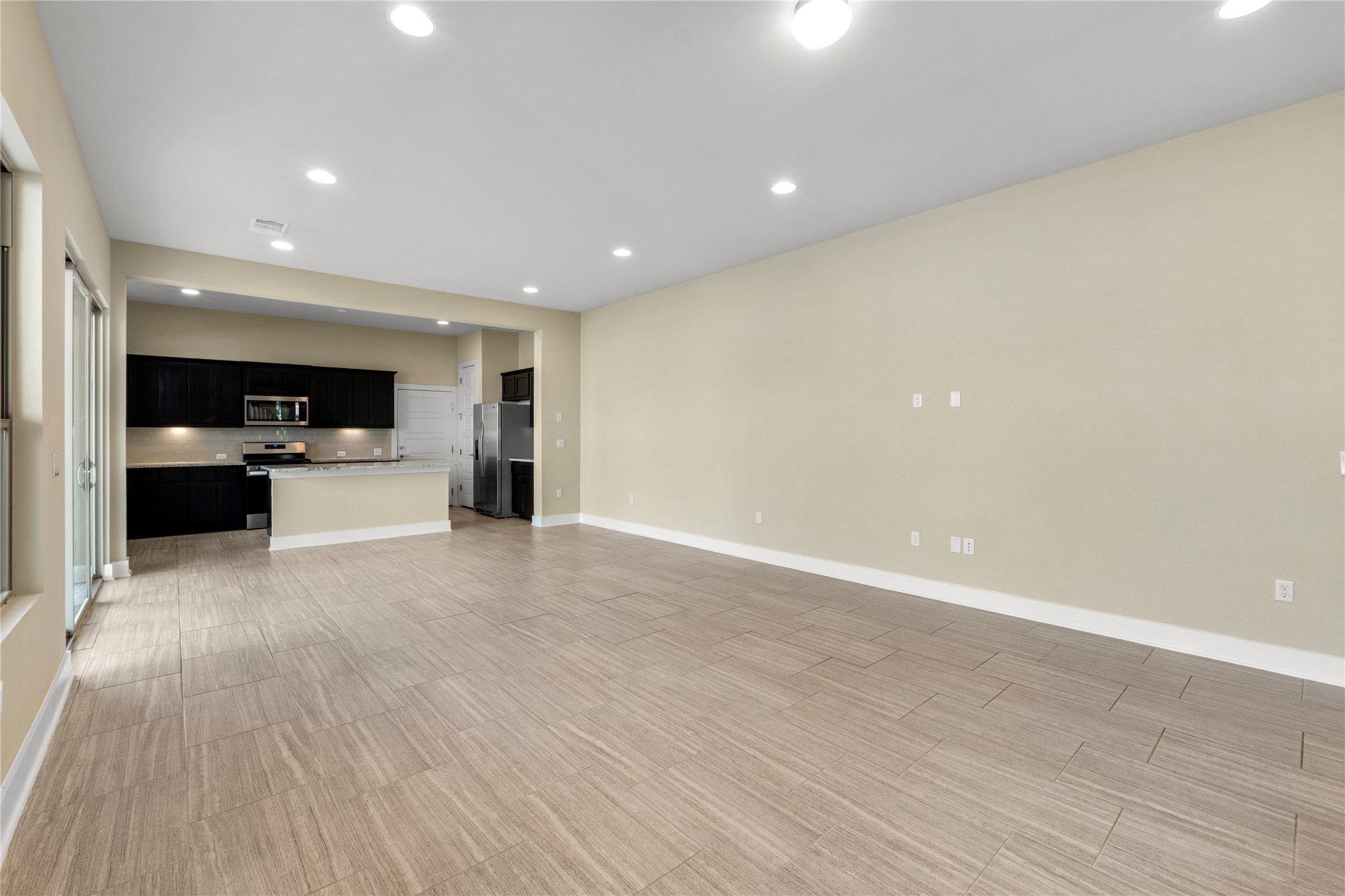 1709 Lawrence Street, Unit 5 Austin, TX 78741 - Photo 40 of 40 An open floor plan connects the main living space directly to the kitchen.
