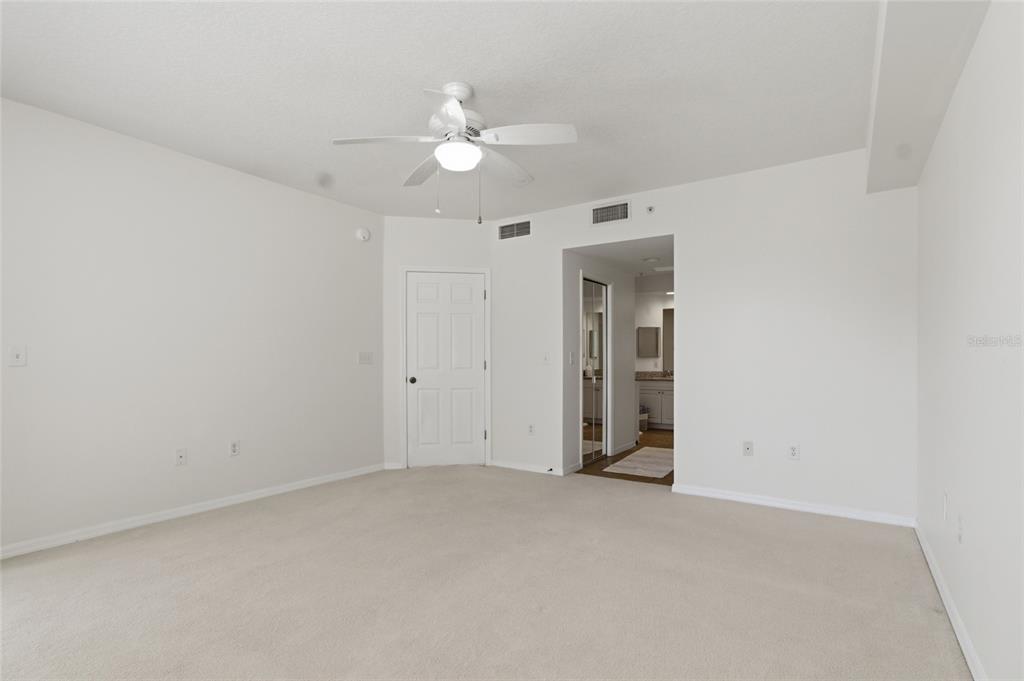 960 Starkey Road, Unit 3106 Largo, FL 33771 - Photo 20 of 39 a view of an empty room with a chandelier fan