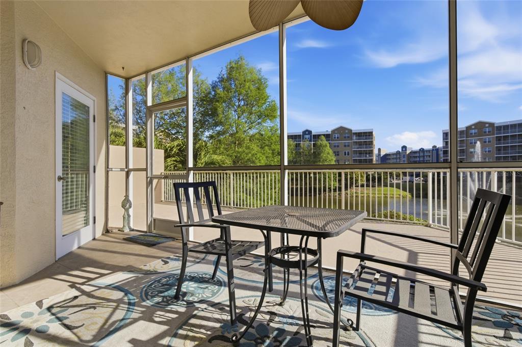 960 Starkey Road, Unit 3106 Largo, FL 33771 - Photo 29 of 39 a view of a balcony with two chairs and a table