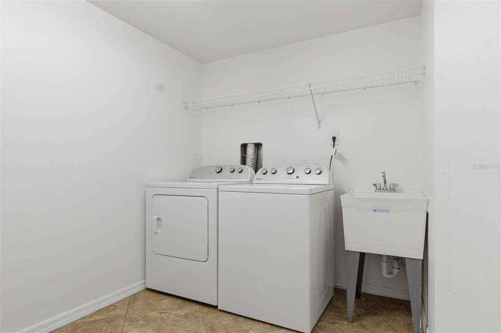 960 Starkey Road, Unit 3106 Largo, FL 33771 - Photo 31 of 39 a utility room with dryer and washer