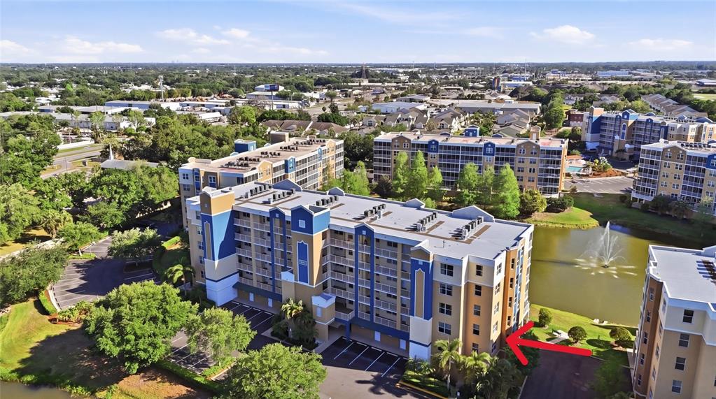 960 Starkey Road, Unit 3106 Largo, FL 33771 - Photo 35 of 39 an aerial view of a city with lots of residential buildings ocean and mountain view in back