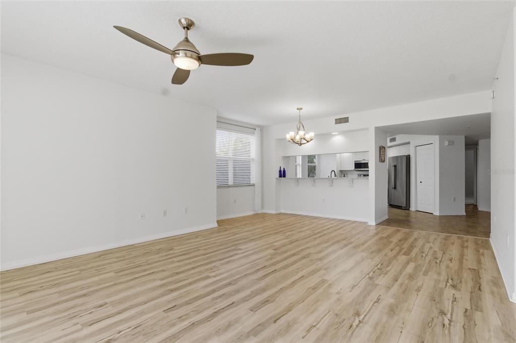 960 Starkey Road, Unit 3106 Largo, FL 33771 - Photo 8 of 39 a view of empty room with wooden floor and ceiling fan