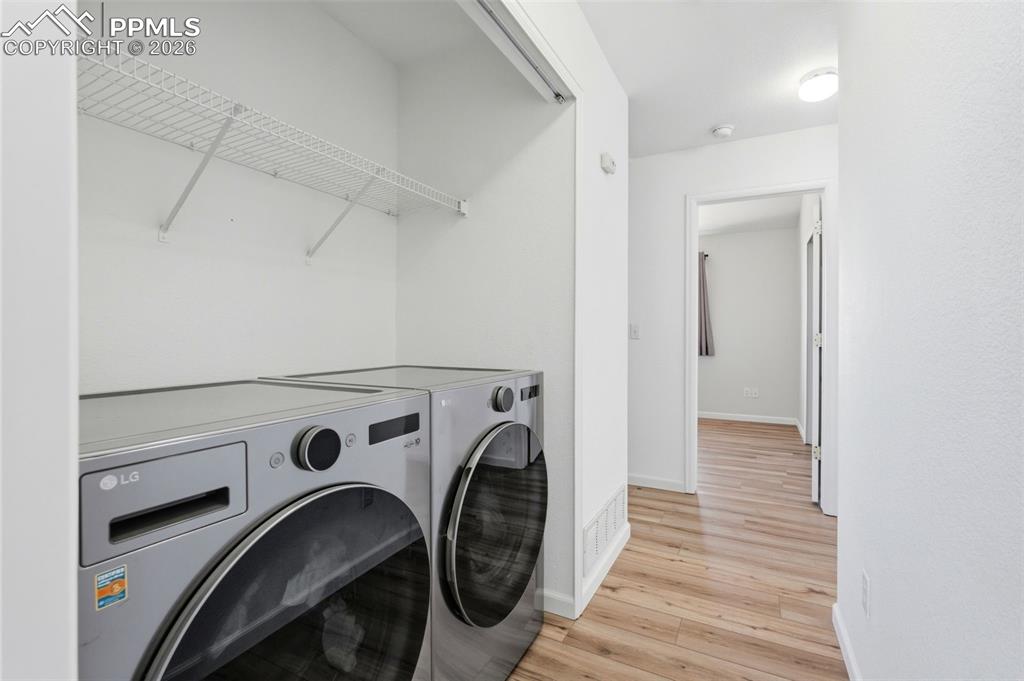 11175 Berry Farm Road Fountain, CO 80817 - Photo 17 of 40 a view of storage and utility room with washer and dryer