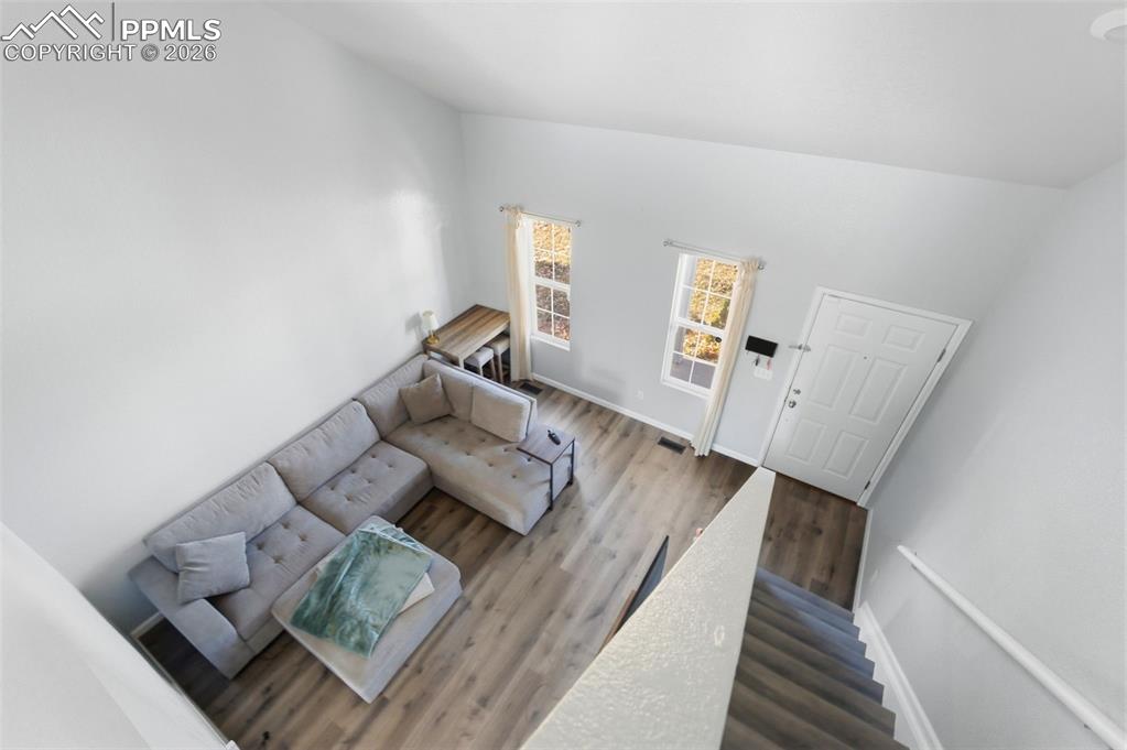 11175 Berry Farm Road Fountain, CO 80817 - Photo 18 of 40 a living room with furniture and wooden floor
