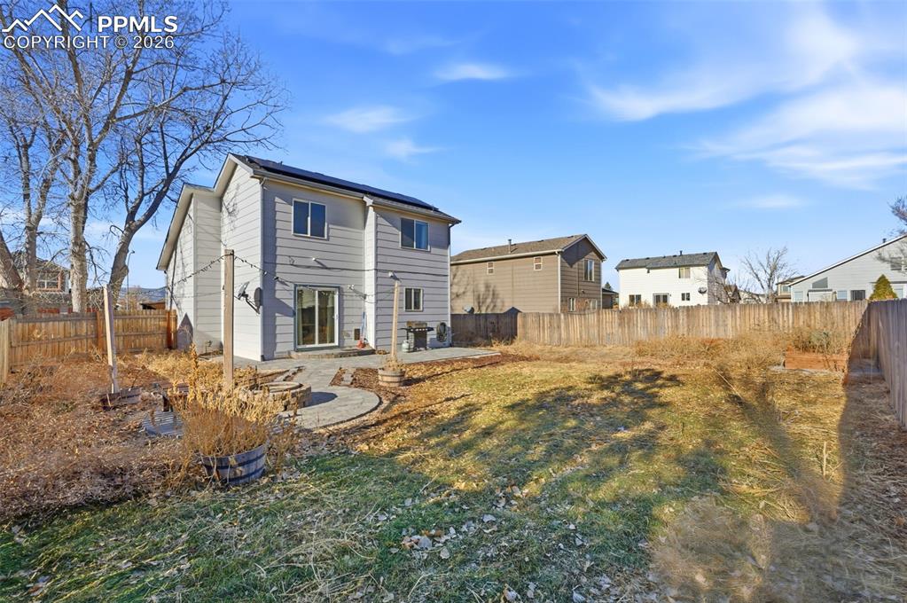11175 Berry Farm Road Fountain, CO 80817 - Photo 27 of 40 a backyard of a house with table and chairs