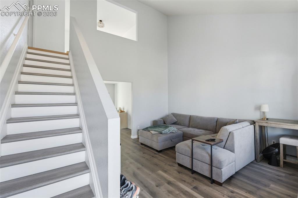 11175 Berry Farm Road Fountain, CO 80817 - Photo 3 of 40 a living room with furniture and a stair