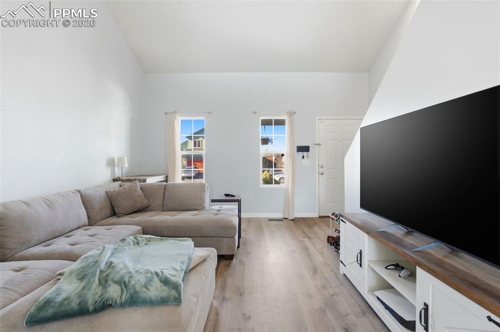 11175 Berry Farm Road Fountain, CO 80817 - Photo 4 of 40 a living room with furniture and a flat screen tv