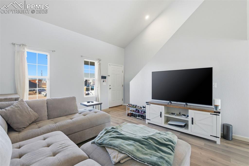 11175 Berry Farm Road Fountain, CO 80817 - Photo 5 of 40 a living room with furniture and a flat screen tv