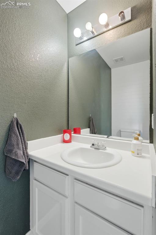 11175 Berry Farm Road Fountain, CO 80817 - Photo 8 of 40 a bathroom with a sink and a mirror