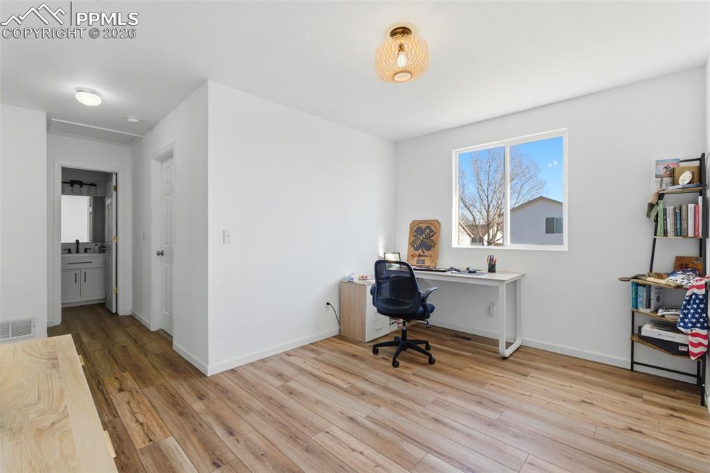 11175 Berry Farm Road Fountain, CO 80817 - Photo 10 of 40 a view of a workspace with furniture and a window