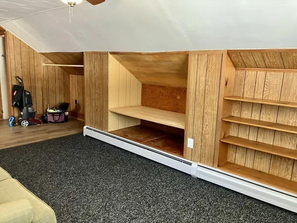 a bed room with a bed and a chandelier