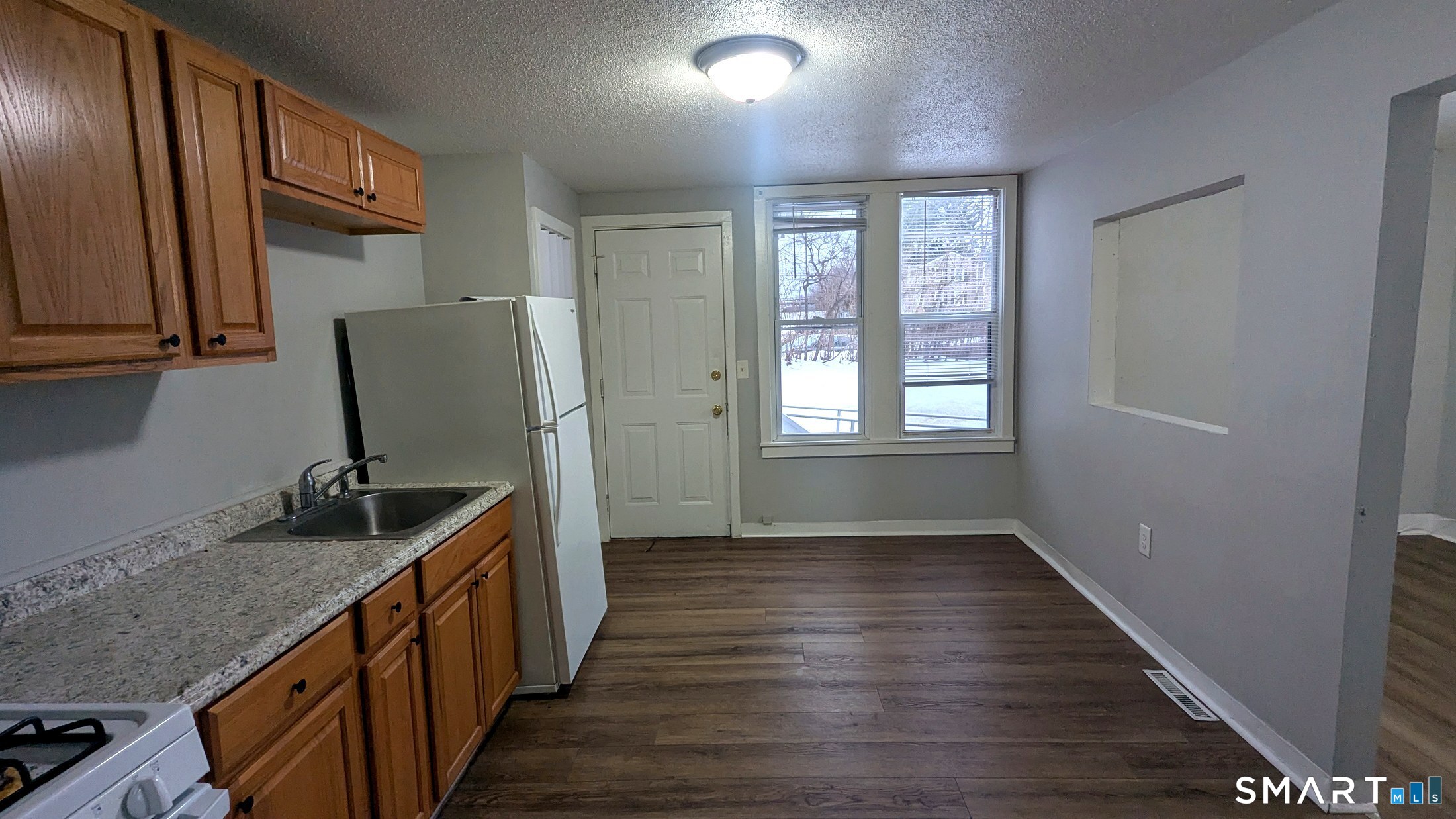116 Old Foxon Road East Haven, CT 06513 - Photo 12 of 35 a kitchen with sink window and cabinets