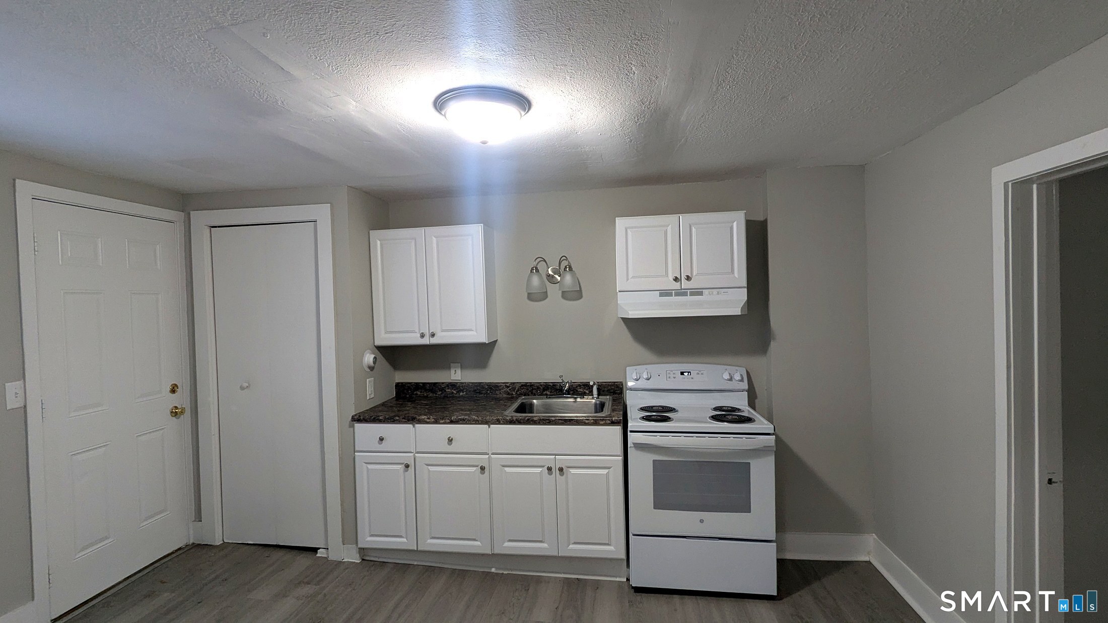 116 Old Foxon Road East Haven, CT 06513 - Photo 13 of 35 a kitchen with stainless steel appliances granite countertop a stove and a refrigerator