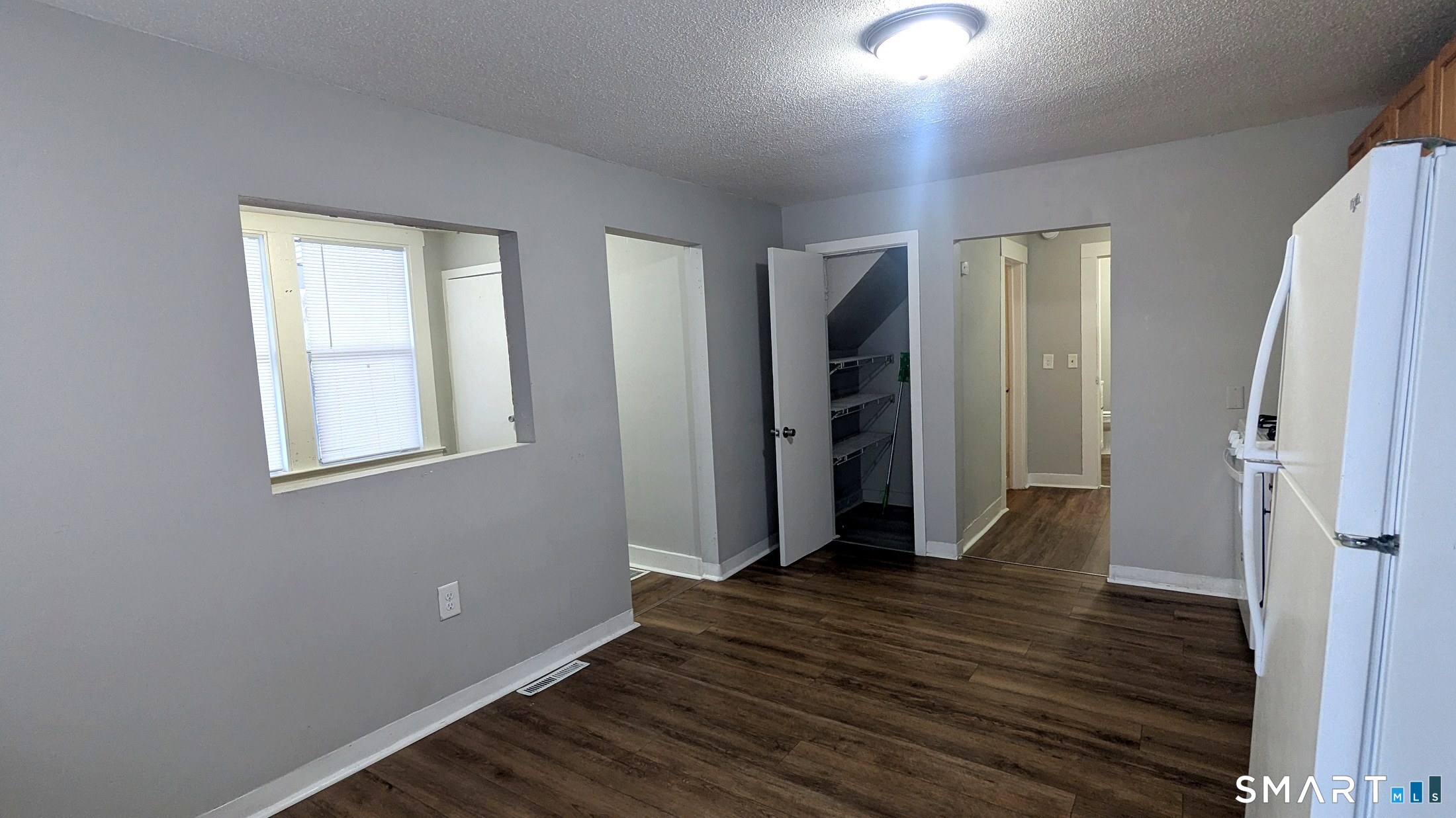 116 Old Foxon Road East Haven, CT 06513 - Photo 20 of 35 an empty room with wooden floor and a window