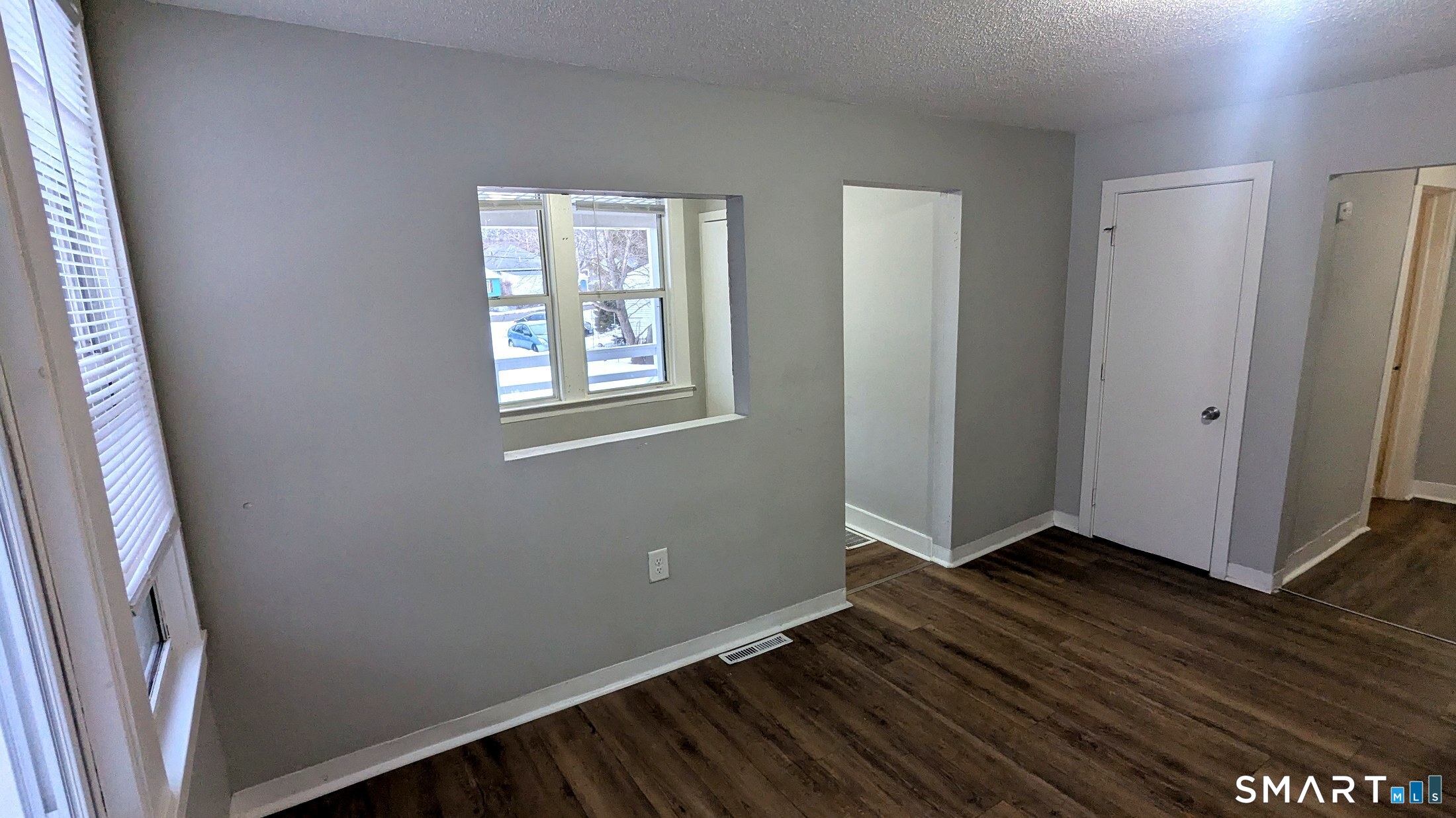 116 Old Foxon Road East Haven, CT 06513 - Photo 22 of 35 an empty room with wooden floor and windows