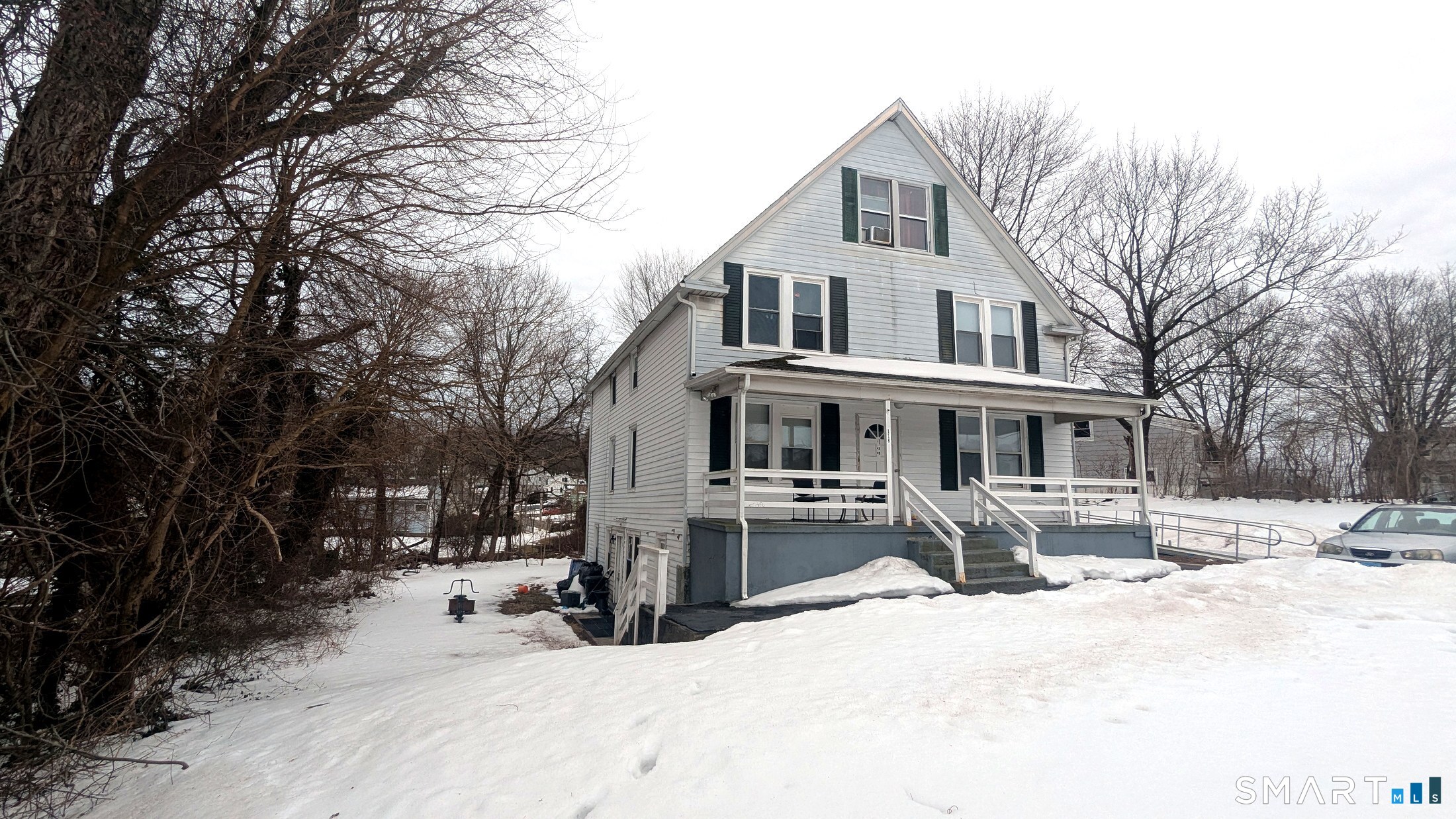 116 Old Foxon Road East Haven, CT 06513 - Photo 30 of 35 a front view of a house with a yard covered with snow