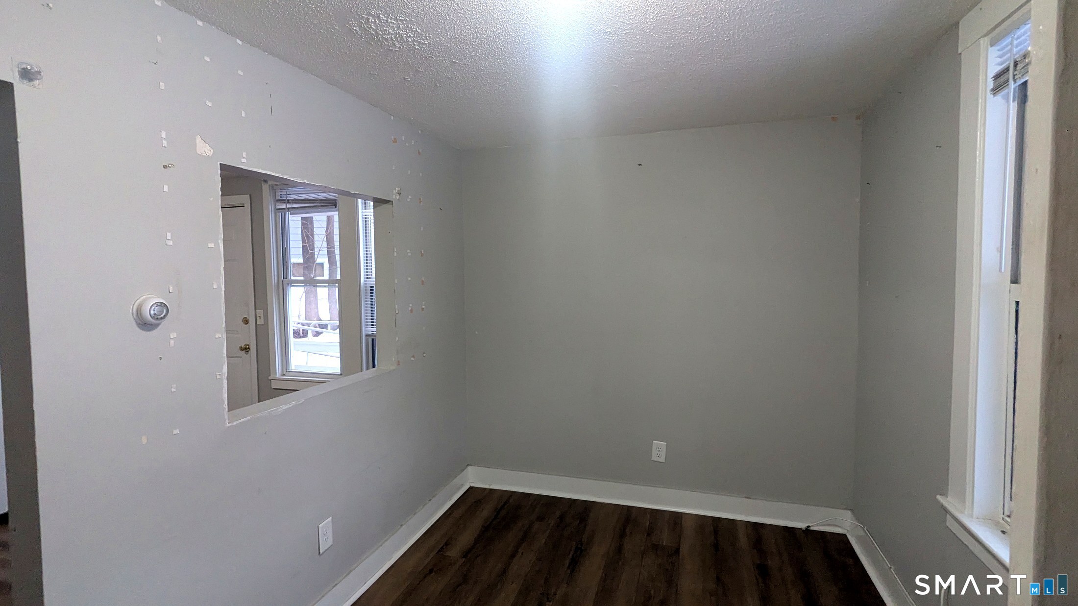 116 Old Foxon Road East Haven, CT 06513 - Photo 3 of 35 a view of a room with wooden floor and a window