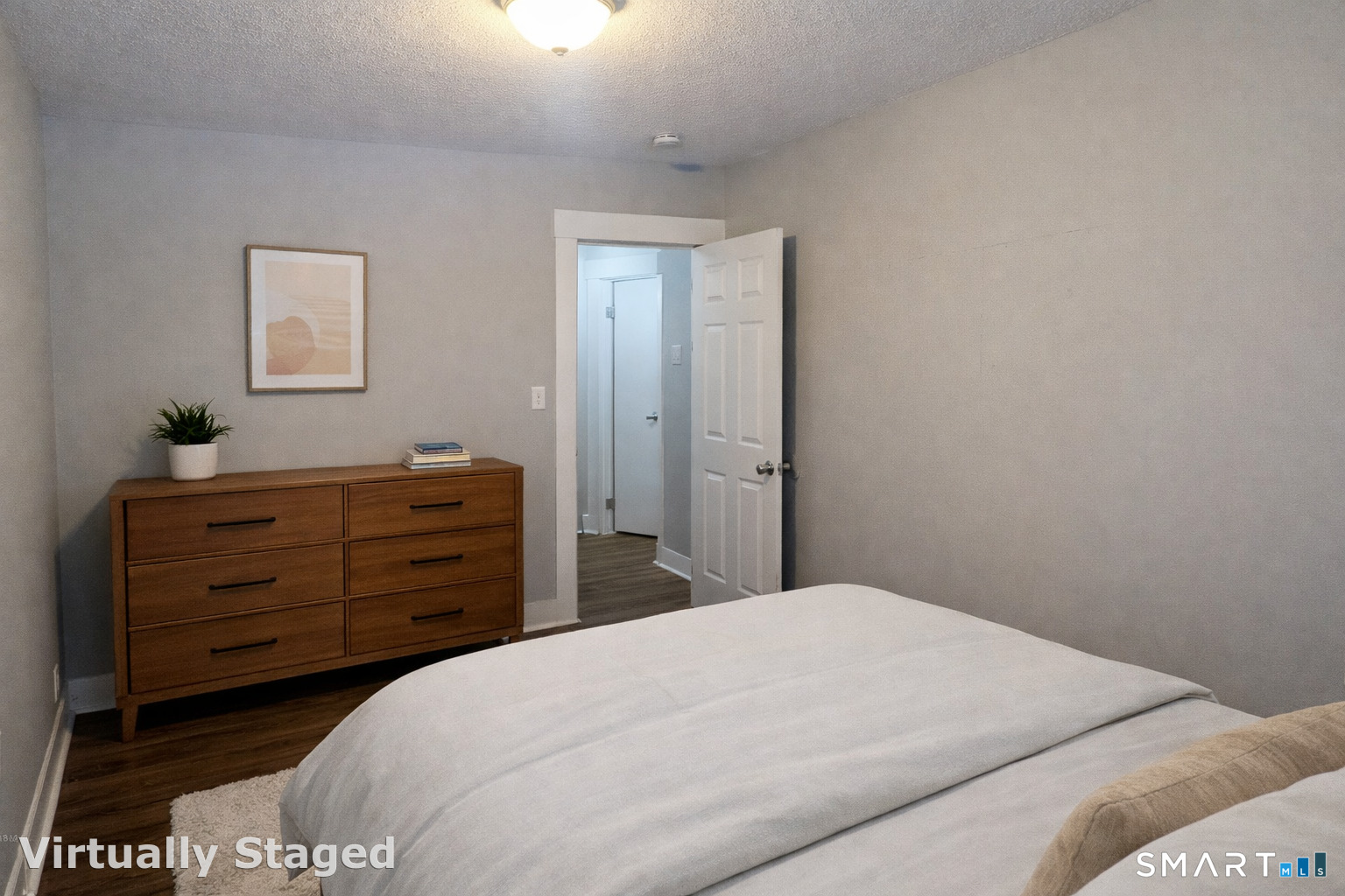 116 Old Foxon Road East Haven, CT 06513 - Photo 7 of 35 a bedroom with a bed and a dresser