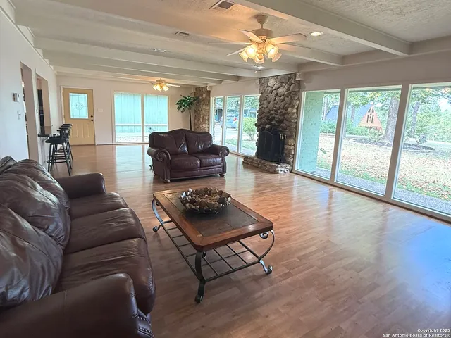 a living room with furniture and a large window
