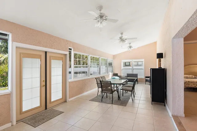 a dining room with furniture and window